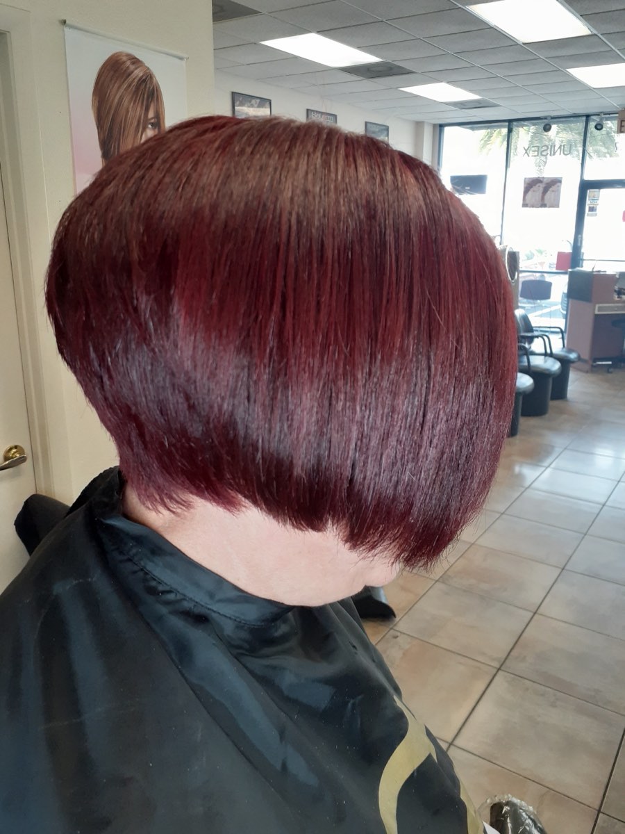 A glossy burgundy bob styled at J J Beauty Salon