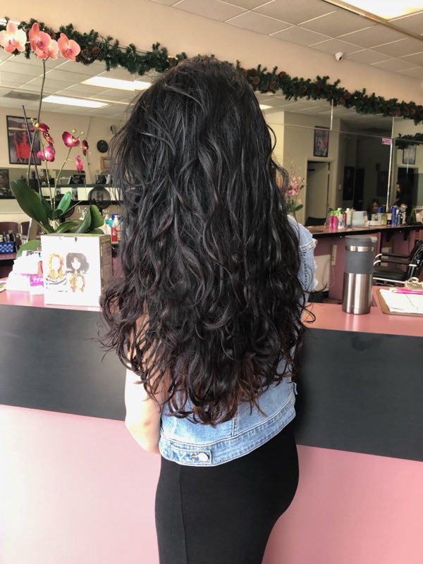 Long wavy dark hair styled at the salon